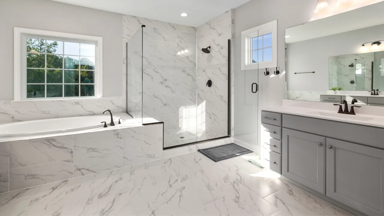 Large-format marble-look porcelain tile in an Oklahoma City bathroom